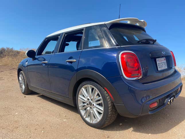 A photo of my blue Mini Cooper S 5-door hatchback from the rear 3/4