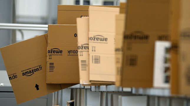 Several cardboard Amazon boxes at a fulfillment center