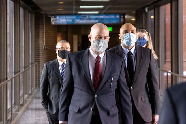 Former Minneapolis Police Officers J. Alexander Kueng (R) and Tou Thao (L) arrive with and attorney Thomas Plunkett (C) at the US District Court in St. Paul, Minnesota, on January 11, 2022, for the pre-trial of three former Minneapolis police officers charged with federal civil rights violations in George Floyd’s death.