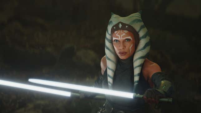 Rosario Dawson as Ahsoka Tano wields two white lightsabers. 