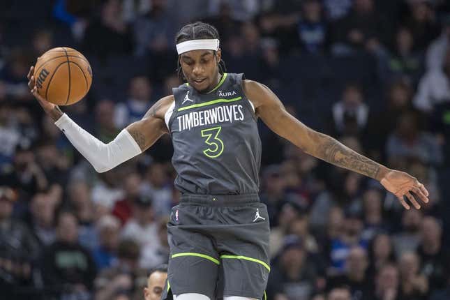 Nov 20, 2023; Minneapolis, Minnesota, USA; Minnesota Timberwolves forward Jaden McDaniels (3) jumps up to save a loose ball against the New York Knicks in the first half at Target Center.