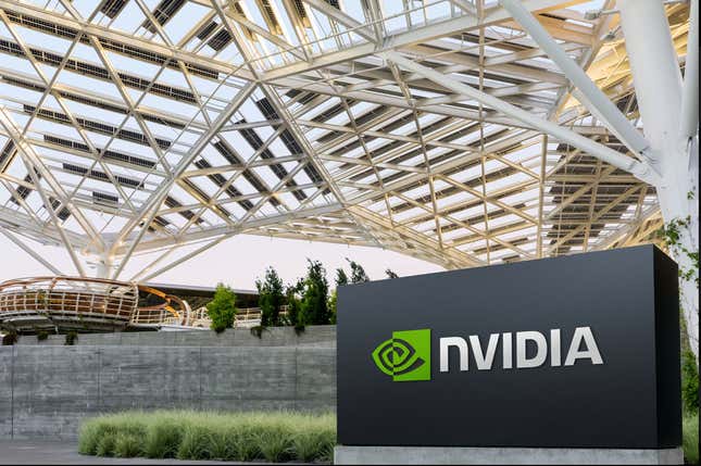 white web-like infrastructure over a building and an Nvidia sign