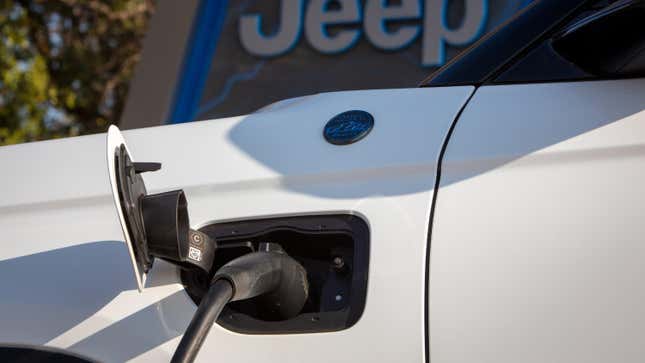 Close-up of a Jeep Grand Cherokee 4xe charging port during recharging.