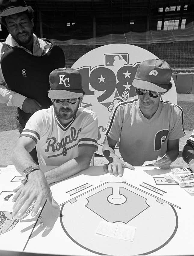 Umpire James Williams, a Strat-o-Matic employee, keeps an eye on the action as Jim Schaefer, left, and Jon Halpern battle it out in the only baseball game in town.