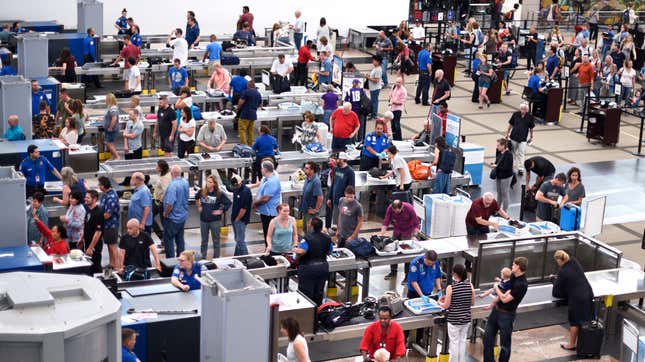 Lines of passengers going through security at the airport