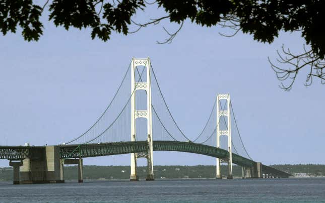 FILE - This July 19, 2002, file photo, shows the Mackinac Bridge that spans the Straits of Mackinac from Mackinaw City, Mich. Michigan regulators have approved a $500 million plan to encase a portion of an oil pipeline that runs beneath a channel connecting two Great Lakes. The state Public Service Commission on Friday, Dec. 1, 2023, approved the proposal for the tunnel through the Straits of Mackinac. (AP Photo/Carlos Osorio, File)