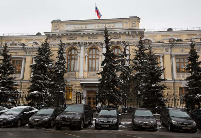 FILE - Cars are parked in front of Russia&#39;s Central Bank building in Moscow, Russia, Friday, Jan. 30, 2015. The Central Bank of Russia raised its key lending rate by one percentage point to 13% on Friday, Sept. 15, 2023, a month after imposing an even larger hike, as concerns about inflation persist and the ruble continues to struggle against the dollar. (AP Photo/Alexander Zemlianichenko, File)