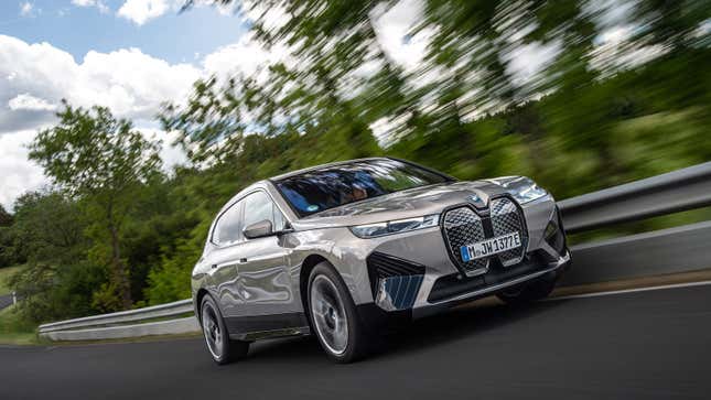 A photo of a silver BMW iX electric SUV. 