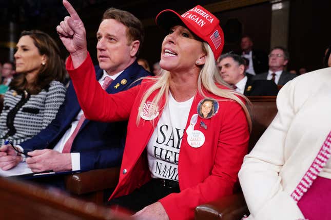 WASHINGTON, DC - MARCH 7: U.S. Rep. Marjorie Taylor Greene (R-GA) shouts at President Joe Biden as he delivers the State of the Union address before a joint session of Congress in the House chamber at the Capital building on March 7, 2024 in Washington, DC. This is Biden’s final address before the November general election. 