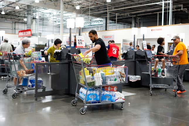 Customers check out inside a Costco store in Teterboro, New Jersey. 