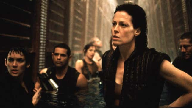 Ripley and the squad stand in waist-high water.