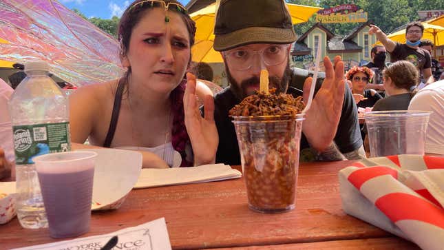 Two people stare at a bbq sundae at a Renaissance Faire.