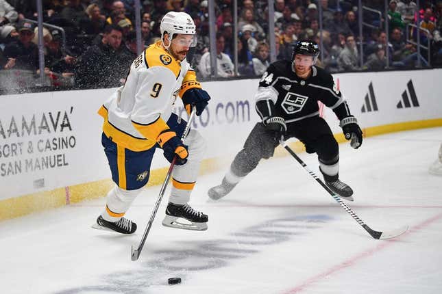 Feb 22, 2024; Los Angeles, California, USA; Nashville Predators left wing Filip Forsberg (9) controls the puck against Los Angeles Kings defenseman Vladislav Gavrikov (84) during the first period at Crypto.com Arena.