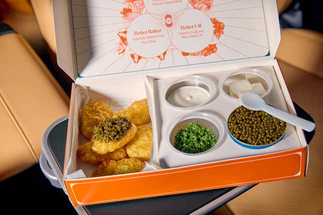 A box of takeout chicken nuggets and caviar