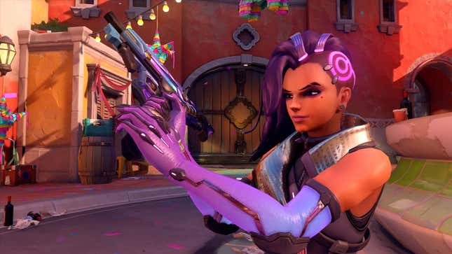 Sombra holds her gun.