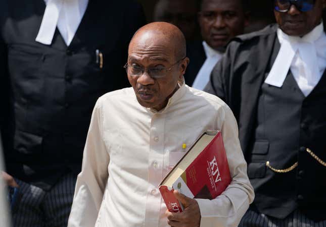 FILE- Godwin Emefiele, Former Central Bank governor, leaves after a court hearing at the Federal High Court in Lagos Nigeria, Tuesday, July 25, 2023. The suspended governor of the Central Bank of Nigeria, who has mostly been in detention since he was removed from office in June, has been charged with procurement fraud. The court which remanded him in prison until it rules on his bail application. (AP Photo/Sunday Alamba, File)