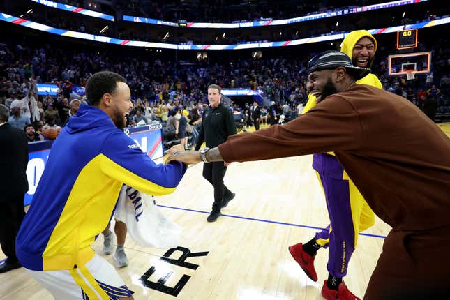 SAN FRANCISCO, CALIFORNIA - OCTOBER 07: Stephen Curry #30 of the Golden State Warriors jokes with Anthony Davis #3 and LeBron James #23 of the Los Angeles Lakers after their game at Chase Center on October 07, 2023 in San Francisco, California. NOTE TO USER: User expressly acknowledges and agrees that, by downloading and/or using this photograph, user is consenting to the terms and conditions of the Getty Images License Agreement. (Photo by Ezra Shaw/Getty Images)