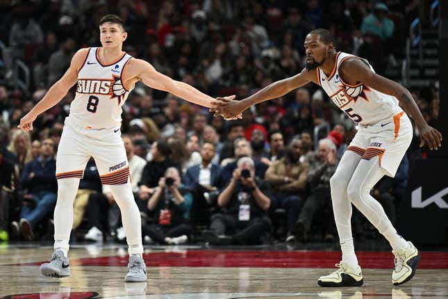 Nov 8, 2023; Chicago, Illinois, USA; Phoenix Suns forward Kevin Durant (35), right, congratulates guard Grayson Allen (8) after Allen hit a three-point shot in the second half against the Chicago Bulls at United Center.