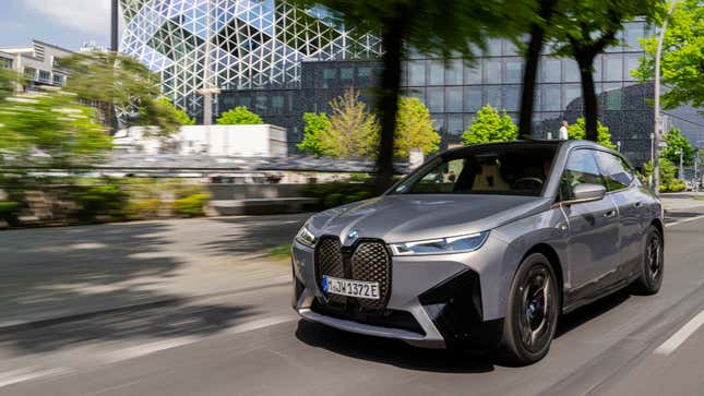 A photo of a silver BMW iX electric SUV. 