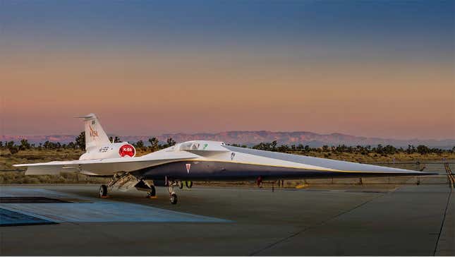 The X-59 plane sits on a runway with mountains in the distance