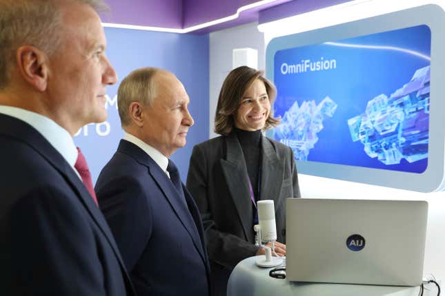 Russian President Vladimir Putin, center, and Sberbank CEO German Gref, left, visit an exhibition on artificial intelligence in Moscow, Russia, Friday, Nov. 24, 2023. Putin takes part in the plenary session of the international conference on artificial intelligence and machine learning &quot;Artificial Intelligence Journey 2023&quot; on the topic &quot;The Generative AI Revolution: New Opportunities.&quot; (Mikhail Klimentyev, Sputnik, Kremlin Pool Photo via AP)