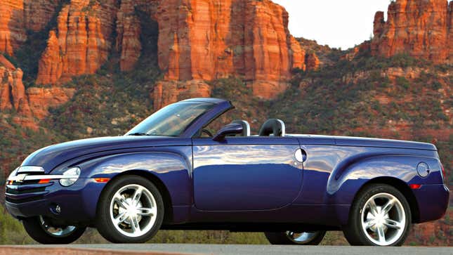 A purple Chevrolet SSR parked in the hills. 