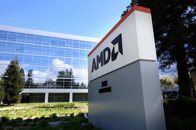 An AMD sign placed outside an office building covered by windows