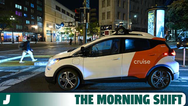 A photo of a Cruise self-driving taxi at night. 