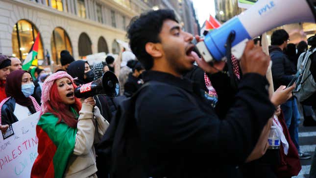 Pro-Palestine activists march as they participate in a Global Strike for Gaza on December 18, 2023 in New York City, New York. Activists gathered at Grand Central Station before marching as they continued to demand a ceasefire in Gaza.