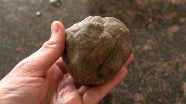A ball of the D.I.Y. Concrete compound with the excess water squeezed out.