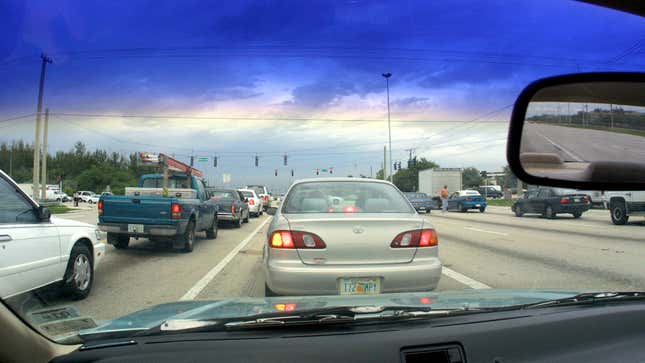 Cars drive near the dangerous intersection of Flamingo Road and Pines Boulevard June 27, 2001 in Pembroke Pines, FL. According to State Farm Insurance Company 357 accidents have taken place at the site in the past two years. (Photo by Joe Raedle/Getty Images)
