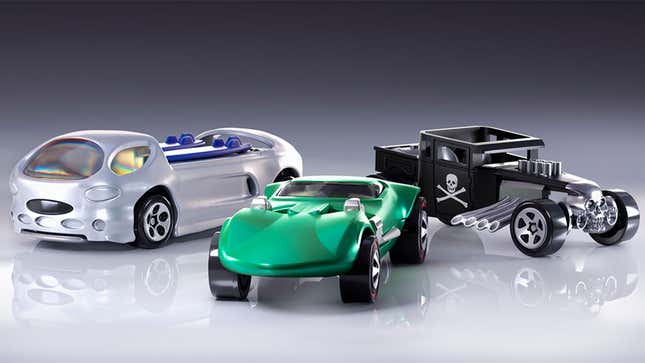 A photo of three Hot Wheels cars. 