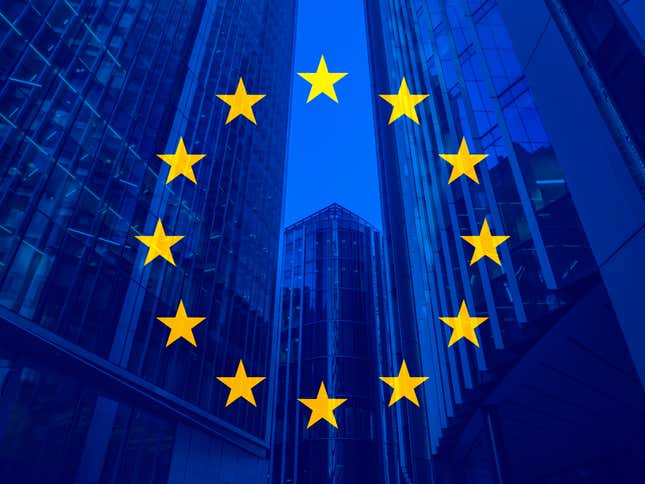 The flag of the European Union (a circle of yellow stars on a blue background) is superimposed on a trio of glass skyscrapers