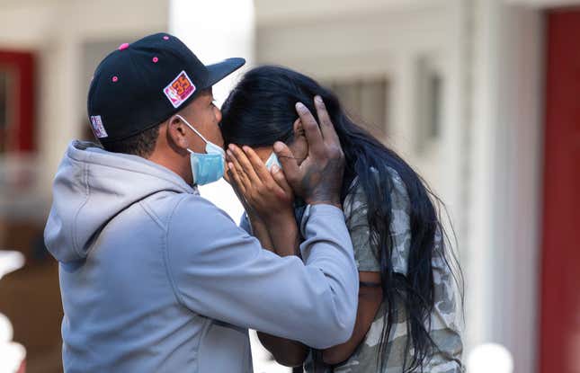 afael Eduardo (left) an undocumented immigrant from Venezuela hugs another immigrant outside of the Saint Andrews Episcopal Church, on Marthas Vineyard.