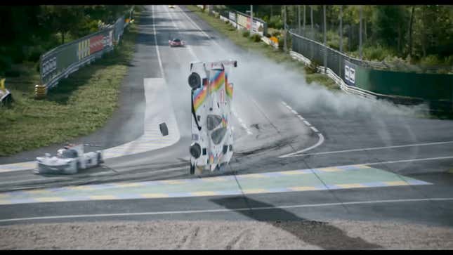 A GT car flips into the air while another takes the right-corner turn.