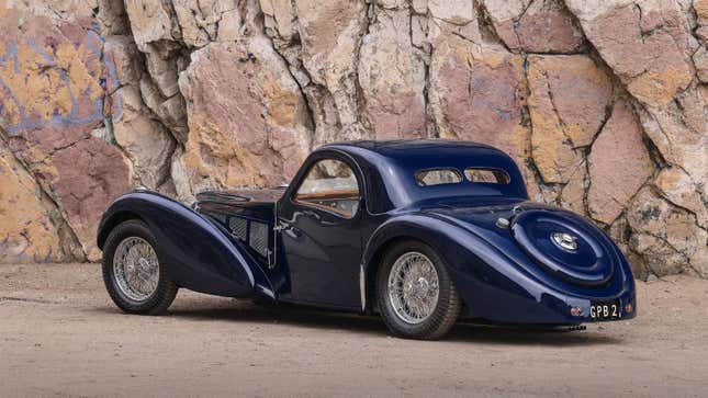 Rear 3/4 view of a dark blue 1937 Bugatti Type 57SC Atalante