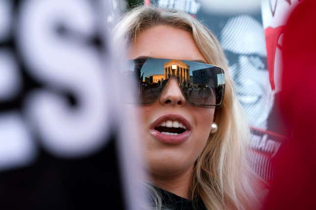 FILE - Isabella DeLuca, of Long Island, N.Y., appears outside the Supreme Court, Oct. 26, 2020, on Capitol Hill in Washington. DeLuca, a conservative social media influencer, has been charged with storming the U.S. Capitol. Court records unsealed Monday, March 18, 2024, show that DeLuca is charged with misdemeanors, including theft of government property, disorderly conduct and entering a restricted area. She was arrested last Friday in Irvine, Calif. (AP Photo/Jacquelyn Martin, File)