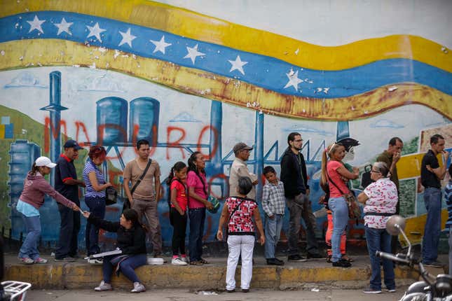 Venezuelans queue to cast their vote