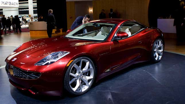 A photo of a red Fisker Karma electric sports car. 