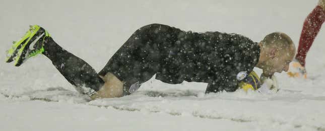 US goalkeeper Brad Guzan eats some snow and makes a save.
