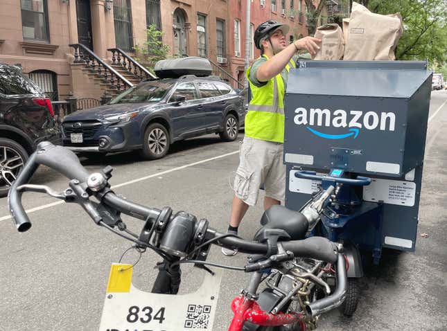 An Amazon employee delivers Amazon Fresh food orders purchased online through Prime.