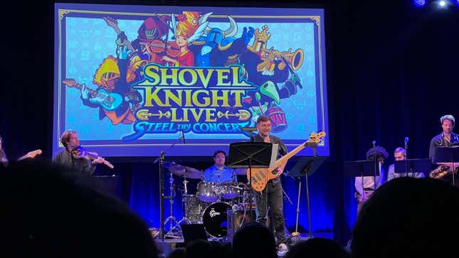 The Shovel Knight Live concert band is shown on stage.