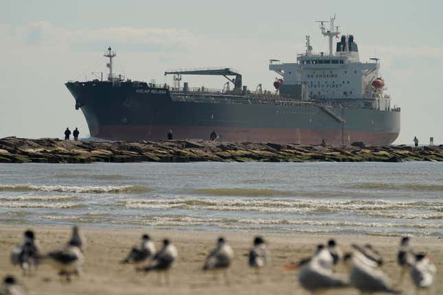 FILE - An oil tanker passes along a channel, March 2, 2022, in Port Aransas, Texas. President Joe Biden&#39;s administration has approved construction of The Sea Port Oil Terminal, a deepwater oil export terminal off the Texas coast that would be the largest of its kind in the United States. Environmentalists called the move a betrayal of Biden’s climate agenda and said would lead to planet-warming greenhouse gas emissions equivalent to nearly 90 coal fired-power plants. (AP Photo/Eric Gay, File)