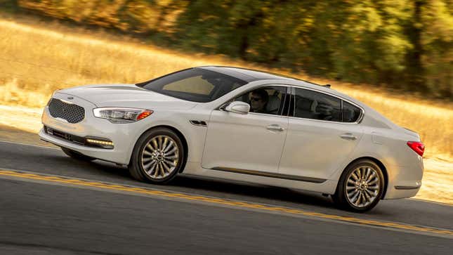 A photo of a white Kia K900 sedan. 