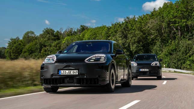 Front 3/4 view of two camouflaged Porsche Cayenne EV prototypes