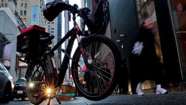 A photo of an electric bike on a street in New York City. 