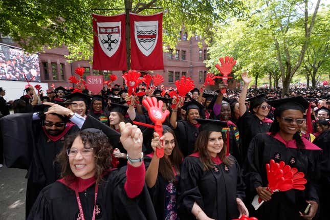 File - Graduating Harvard University students celebrate their degrees during commencement ceremonies, on May 25, 2023 in Cambridge, Mass. Student loan payments resume in October after a three-year pause due to the pandemic. (AP Photo/Steven Senne, File. )