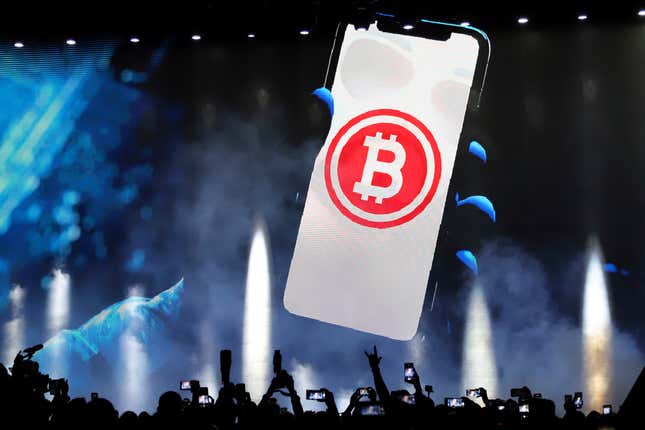 FILE - A bitcoin symbol is presented on an LED screen during the closing ceremony of a congress for cryptocurrency investors in Santa Maria Mizata, El Salvador, Saturday, Nov. 20, 2021. (AP Photo/Salvador Melendez, File)