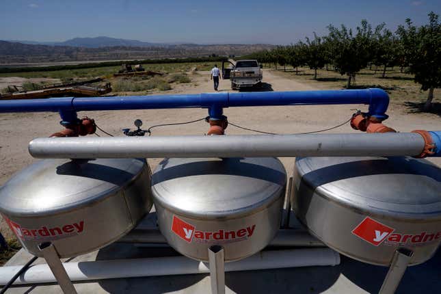 A water filtration system is placed next to a pistachio orchard owned by Jim Harrington, Wednesday, Sept. 20, 2023, in Ventucopa, Calif. Harrington is one of the small farmers, cattle ranchers and others living near the tiny town of New Cuyama whose water supplies and livelihoods are at the heart of a groundwater rights lawsuit brought by two of the nation&#39;s biggest carrot farming companies. (AP Photo/Marcio Jose Sanchez)