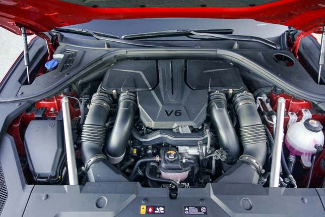 A twin turbo V6 under the hood of a GV70 SUV.